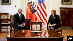 U.S. Vice President Mike Pence, right, chats with Chile's President Michelle Bachelet during a meeting at La Moneda government palace in Santiago, Chile, Aug. 16, 2017.