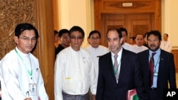 Visiting UN rights envoy Tomas Ojea Quintana (C) arrives for a meeting with Myanmar's speaker of the lower house of parliament, Thura Shwe Mann (not pictured), in Naypyidaw on August 23, 2011.