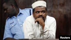 Aboud Rogo Mohammed stands inside the dock at a Law Court in Nairobi, December 22, 2010. 