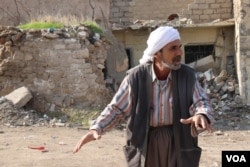 This Mosul resident says his children were killed in the airstrike that destroyed his home more than a year ago, but he has had no help in trying to rebuild, Nov. 21, 2018. (H.Murdock/VOA)