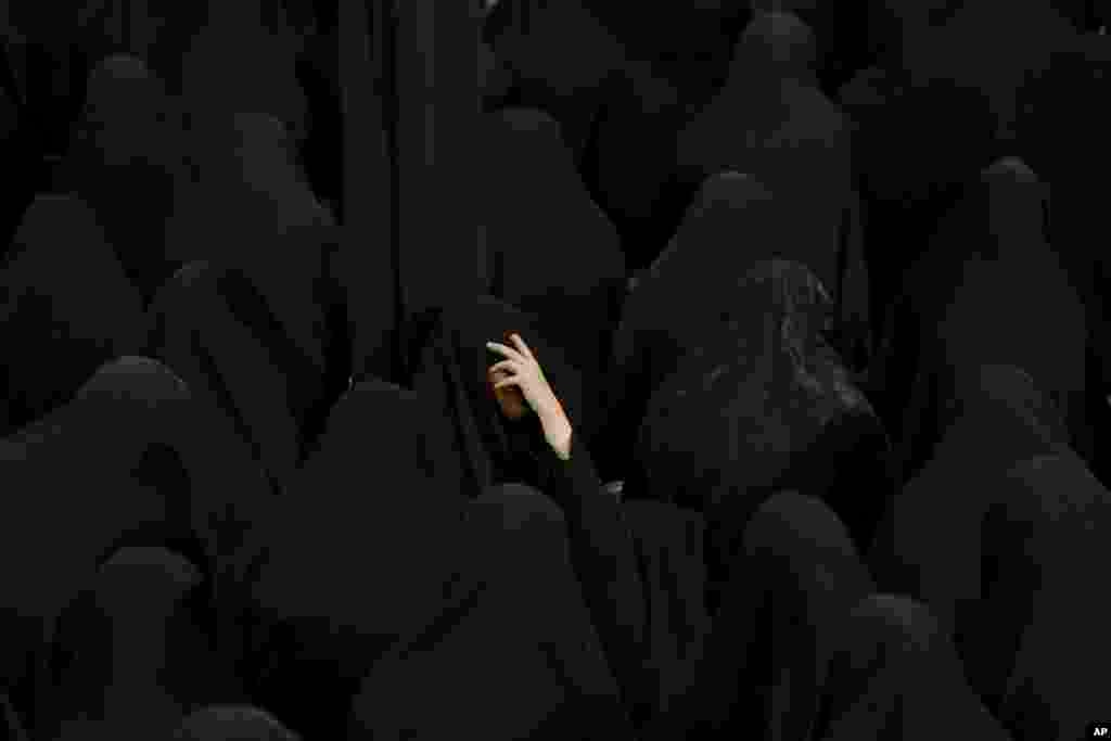 Muslim Shi'ite women mourn during the holy day of Ashoura, at the Sadat Akhavi Mosque in Tehran, Iran.