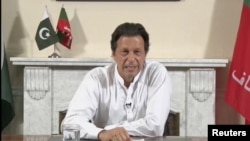 Cricket star-turned-politician Imran Khan, chairman of Pakistan Tehreek-e-Insaf (PTI), gives a speech as he declares victory in the general election in Islamabad, Pakistan, in this still image from a July 26, 2018 handout video by PTI. PTI handout/via REUTERS TV 