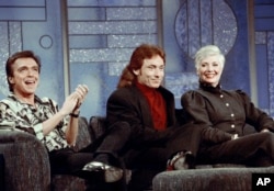 FILE - In this July 13, 1993, file photo, former Partridge Family cast members David Cassidy, from left, Danny Bonaduce and Shirley Jones reunite on the Arsenio Hall Show, Los Angeles, Calif. This was the first time the three had appeared together since t