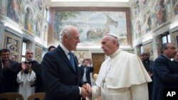 Vatican Pope Syria: Pope Francis shakes hands with UN Special Envoy for Syria Staffan de Mistura, as they meet at the Vatican Thursday, Sept. 29, 2016, prior to a conference on the situation in Syria and Iraq held by Catholic charities operating in those regions. 