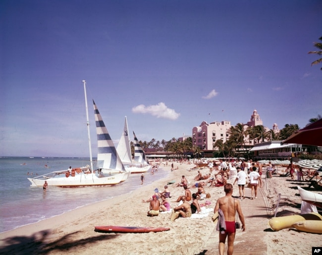 Waikiki beach, Hawaii, in July 1961. Post WWII settlement and tourism led to a boom in housing developments and hotels, leading to more land struggles with Native Hawaiians.