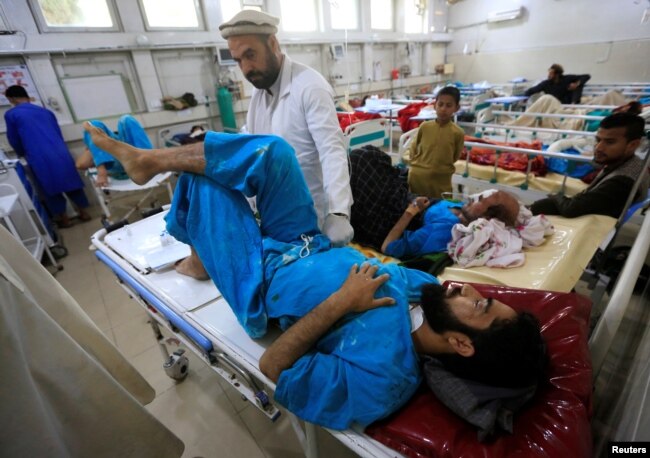 An injured man receives treatment in a hospital, after a blast in Jalalabad, Afghanistan, April 8, 2019.