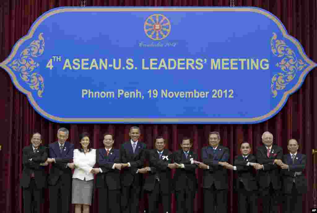 U.S. President Barack Obama, fifth from left, stands hand in hand with ASEAN leaders for a family photo during the ASEAN-U.S. leaders&#39; meeting at the Peace Palace in Phnom Penh, Cambodia, Monday, Nov. 19, 2012. They are, from left, Philippines&#39; President Benigno Aquino III, Singapore&#39;s Prime Minister Lee Hsien Loong, Thailand&#39;s Prime Minister Yingluck Shinawatra, Vietnam&#39;s Prime Minister Nguyen Tan Dung, Obama, Cambodia&#39;s Prime Minister Hun Sen, Brunei&#39;s Sultan Hassanal Bolkiah, Indonesia&#39;s President Susilo Bambang Yudhoyono, Laos Prime Minister Thongsing Thammavong, Malaysia&#39;s Prime Minister Najib Razak and Myanmar&#39;s President Thein Sein. (AP Photo/Carolyn Kaster)