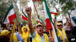 FILE - Mort Zadeh, of Indianapolis, center, shouts during a rally against Iranian President Hassan Rouhani outside United Nations headquarters ahead of the leader's address to the 70th session of the U.N. General Assembly, Monday, Sept. 28, 2015, in New York. 