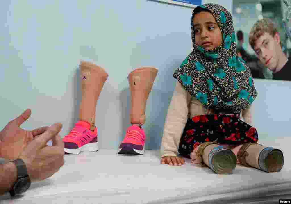 Maya Meri, 8, waits at a prosthetic center in Istanbul, Turkey, July 5, 2018. Merhi was born with no legs due to a congenital condition. After pictures of her plight in Syria were seen around the world, she was brought to Istanbul for treatment. 
