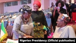 Shugaba Buhari tare da tsohuwar Ministar kudin Najeriya Ngozi Okonjo-Iweala