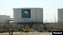 FILE - Oil tanks seen at the Saudi Aramco headquarters during a media tour at Damam city, Nov. 11, 2007. 