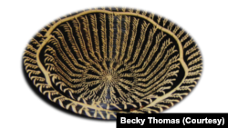 A black longleaf pine needle basket made by Becky Thomas, Clifton Choctaw Tribe member