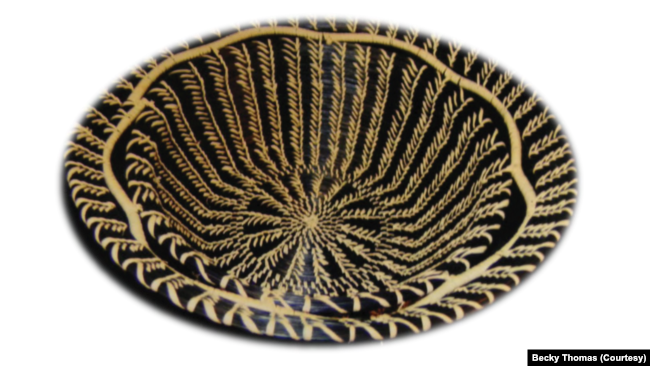 A black longleaf pine needle basket made by Becky Thomas, Clifton Choctaw Tribe member