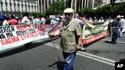 A pensioner joins a demonstration against new austerity measures in Athens June 9, 2011