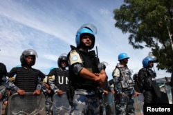 FILE - U.N. peacekeepers are seen at an internally displaced persons camp in the United Nations Mission In South Sudan (UNMISS) base in Juba, May 6, 2014.