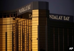 FILE - In this Oct. 3, 2017, file photo, windows are broken at the Mandalay Bay resort and casino in Las Vegas, the room from where Stephen Craig Paddock fired on a nearby music festival, killing 58 and injuring hundreds on Oct. 1.