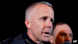 FILE - Austin Police Chief Brian Manley briefs the media in the Austin suburb of Round Rock, Texas, March 21, 2018. Manley says a "domestic terrorist" set off a series of explosions that killed two people and severely wounded four others in the Texas capital. 