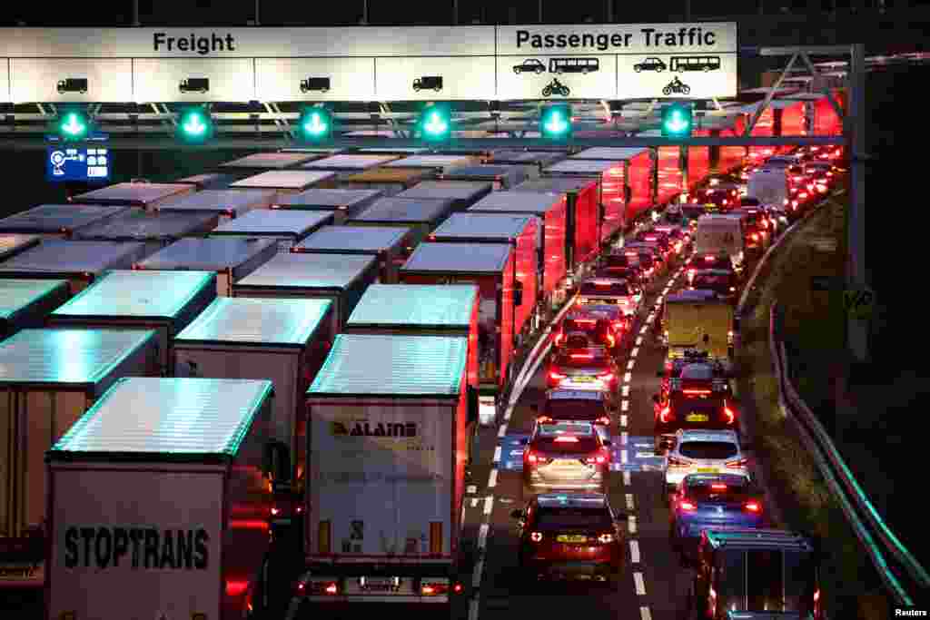 Cars and trucks queue at the entrance of the Eurotunnel, ahead of increased restrictions for travelers to France from Britain, in Folkestone, Britain.