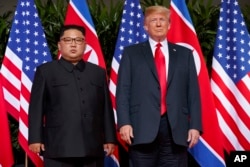FILE - U.S. President Donald Trump meets with North Korean leader Kim Jong Un on Sentosa Island, in Singapore, June. 12, 2018.