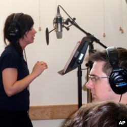 Audio engineer Brad Kaminski records a song by Sarah Hull.