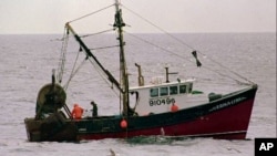 Crewmen on the trawler Erika-Lynn of Port Clyde, Maine, fish in the Gulf of Maine in this June 1997 photo. Stocks of the once-plentiful cod fish are near collapse.