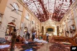 Dead bodies of victims lie inside St. Sebastian's Church damaged in blast in Negombo, north of Colombo, Sri Lanka, April 21, 2019.
