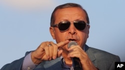 Turkish President Recep Tayyip Erdogan addresses a rally in the courtyard of the Haci Bayram Mosque in Ankara, May 26, 2015.