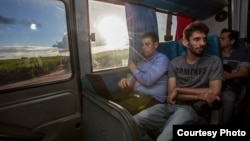 Dr. Nick Loman, left, and members of the ZIBRA team are seen travelling from Natal to Joao Pessoa in north-east Brazil on the lab-equipped minibus. (Courtesy - Ricardo Funari)