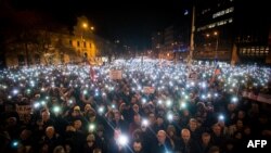 Protesters gather in Bratislava, Slovakia, on on February 21, 2019, the first anniversary of the murder of investigative journalist Jan Kuciak and his fiancee Martina Kusnirova. (Photo by VLADIMIR SIMICEK / AFP)
