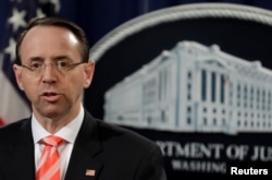 FILE - U.S. Deputy Attorney General Rod Rosenstein speaks at a news conference at the Justice Department in Washington, March 23, 2018.