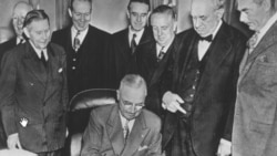 President Harry Truman signing the European Recovery Act