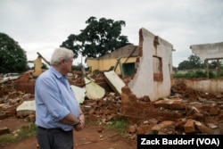 Stephen O’Brien, the U.N.’s top humanitarian official, looks over the main mosque in Bangassou, Central African Republic, that was burned down and destroyed during attacks involving the Christian anti-balaka in May.
