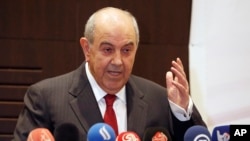 FILE - Iraqi Vice President Vice President Ayad Allawi speaks to reporters in Baghdad, Iraq, Nov. 3, 2016.