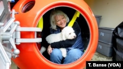 Jeanne Johnson plans to ride out a tsunami with her dog, Trixie, in Survival Capsule's tsunami pod. 