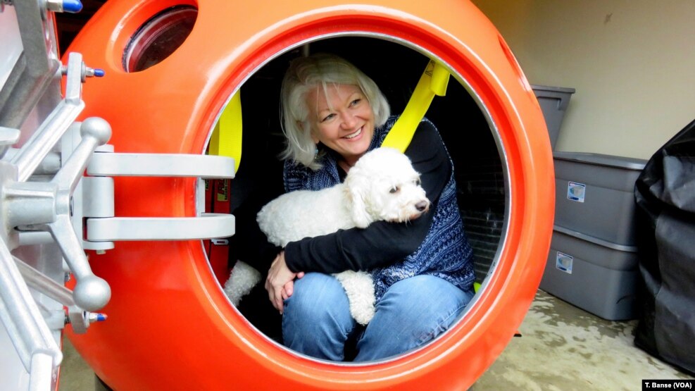 Jeanne Johnson plans to ride out a tsunami with her dog, Trixie, in Survival Capsule's tsunami pod. 