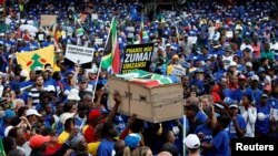 Protesters carry a mock coffin at the Freedom Day rally organized by the newly-formed Freedom Movement in Pretoria, South Africa, April 27, 2017. 