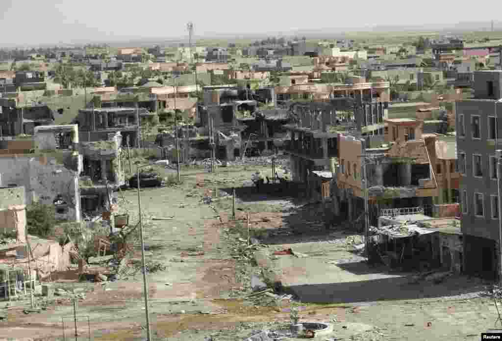 A general view shows damaged houses after fighting in the city of Ramadi, Iraq, June 19, 2014.