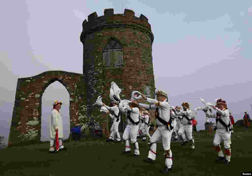 Leicester Morris Men dance at Bradgate Park in Newtown Linford, central England. The May Day Morris celebration is a traditional rite thought to be connected to changing seasons and fertility.
