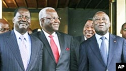 Ivory Coast President Laurent Gbagbo, right, with Kenya's Prime Minister Raila Odinga, left, Sierra Leone's President Ernest Bai Koroma, center, after offering Laurent Gbagbo an amnesty deal at the presidential palace in Abidjan, 03 Jan 2011