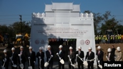 Thailand's Prime Minister Prayuth Chan-ocha (C) and Wang Xiaotao (C-L), a representative of the Chinese Government, participate in a groundbreaking ceremony in Nakhon Ratchasima Province, Thailand, Dec. 21, 2017.