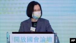 FILE - Taiwan's President Tsai Ing-wen delivers a speech during the opening of the 2021 Open Parliament Forum in Taipei, Taiwan, Dec. 2, 2021. Taiwan will be among the participants of a Summit for Democracy hosted by U.S. President Joe Biden. 