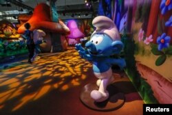 Smurf characters are seen at the Smurf Experience exhibition, depicting a larger-than-life recreation of the Smurf village, marking the 60th anniversary of the creation of the Smurfs by cartoonist Peyo, in Brussels, Belgium, June 12, 2018.
