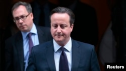 FILE - Britain's Prime Minister David Cameron leaves 10 Downing Street in London, Nov. 26, 2015.