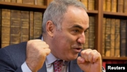 FILE - Former world chess champion and political activist Garry Kasparov attends a news conference in Paris, France, Oct. 16, 2014.