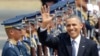 President Barack Obama waves to the media upon arrival Monday at the Ninoy Aquino International Airport in Manila, Philippines, April 28, 2014.