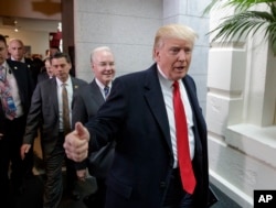 FILE - President Donald Trump and Health and Human Services Secretary Tom Price arrive on Capitol Hill in Washington, March 21, 2017, to rally support for the Republican health care overhaul by taking his case directly to GOP lawmakers.