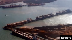 FILE - Ships waiting to be loaded with iron ore are seen at Port Hedland in the Pilbara region of Western Australia.