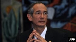 FILE - Guatemala's then-President Alvaro Colom, Oct. 1, 2010, described as "crimes of lese-humanity" the study conducted by the United States more than 60 years ago in Guatemala in which researchers infected hundreds of people with syphilis and gonorrhea without their consent.