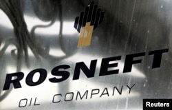 FILE - A logo of Russian state oil firm Rosneft is seen at its office in Moscow, Oct. 18, 2012.
