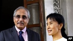 Burma's pro-democracy leader Aung San Suu Kyi with Vijay Nambiar, chief of staff for UN Secretary-General Ban Ki-moon at her home in Rangoon, 27 Nov 2010